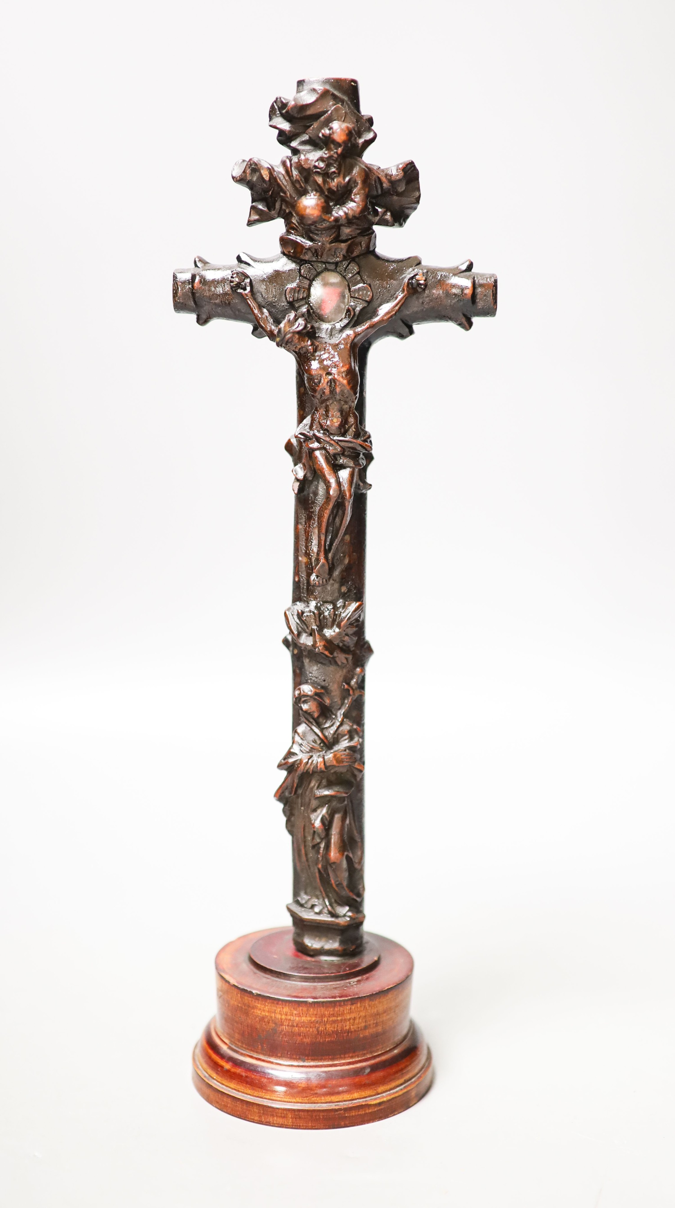 A carved wood crucifix 33cm